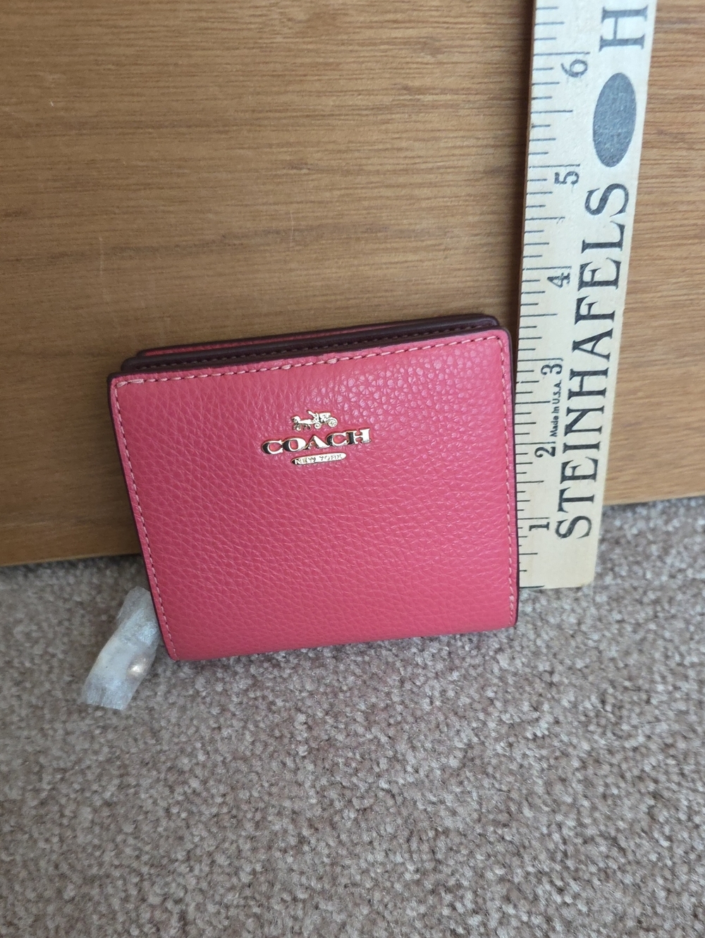 Coach Pink Pebbled Leather Bifold Wallet with Gold Logo